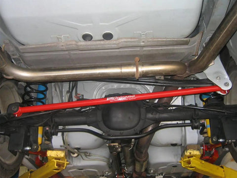 Red Non Adjustable Panhard Bar For 1998 To 2002 Camaro Firebird GM F Body Rear Tubular Suspension Upgrade For Improved Stance Handling And Wheel Alignment, installed under rear axle
