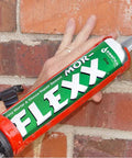 Applying Mor-Flexx Caulking For Mortar Gray 10.5 Oz Cartridge on brick wall, textured concrete sealant for DIY masonry repairs