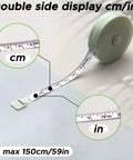 59-inch tape measure in green with dual cm/inch display, part of the Multi Size Pipe Insulation Cutting Guide Kit