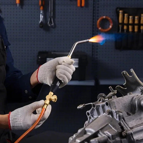 Person using Air Acetylene Torch Kit With 149 Inch Hose, Two Welding Tips, CGA200 Regulator And Torch Handle For Home DIY Projects