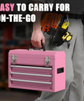 Person carrying 3-Drawer Metal Tool Box With Locking Mechanism And EVC Liners, Pink Finish, Heavy-Duty Steel Construction For Garage