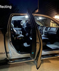 2009-2018 Dodge Ram interior with 12 Piece 6000K White LED Lighting Kit, includes map, dome, and footwell illumination at night.