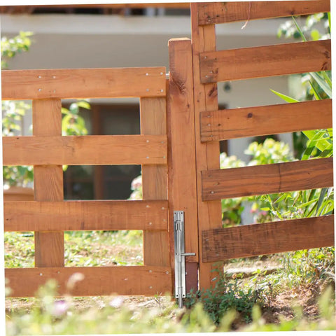 Top Tier Heavy Duty 10 Pack Stainless Steel Slide Bolt Latches For Securing French Doors Barn Sheds And Gates With No Sweat Install And Rock Solid Security Hold on a wooden gate.