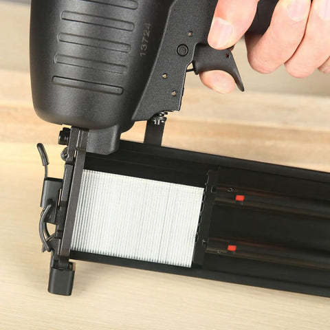 Close-up of Pro Grade 16 Gauge Pneumatic Straight Finish Nailer showing trigger and nail reload area