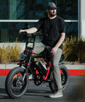 Man sitting on a fat bike with 2-Pack Heavy Duty Fat Bike Inner Tubes 20x4.0 To 4.5 Inch With Schrader Valve 102/114-406.