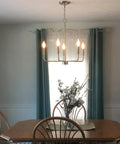 Camille 22 Inch Modern 5-Light Candle Style Chandelier With Open Frame In Brushed Nickel Finish above dining table