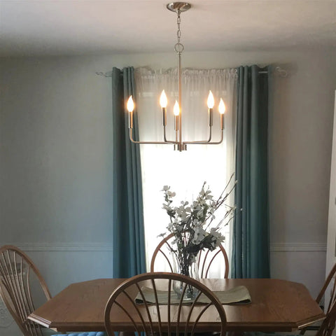 Camille 22 Inch Modern 5-Light Candle Style Chandelier With Open Frame In Brushed Nickel Finish above dining table