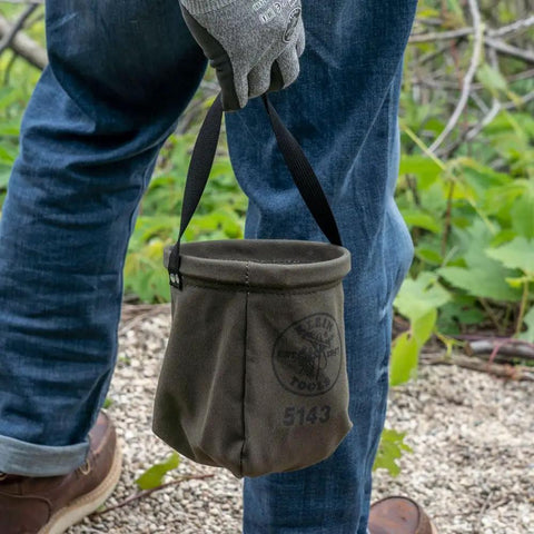 Person holding Canvas Tapered-Bottom Tool Bucket With Two Interior Pockets And Snap Clip Made From No 10 Canvas 8 Inch High