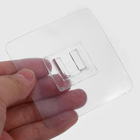 Easy Install 30 Pack Adhesive Furniture Anti Tip Wall Anchors Kit For Home Safety Self Drilling Drywall Anchors Cabinet And Drawer Security Straps Strong Durable Wall Safe Furniture Stabilizers clear adhesive wall anchor pad held in hand