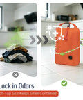 Dirty laundry pile next to orange Dual Pack Compression Laundry Bag For Travel, Pump-Free Wet-Dry Organizer, showing odor protection