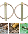 Get Your Yard Gear Fixin' With These 12 Heavy Duty Carbon Steel Retaining Pins Featuring Ring Locks For Tractors Mowers And Trailers To Keep Everything Secure And Rust-Free In The Dirt, showcasing two golden wire lock pins.