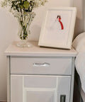 Chrome Plated Cabinet Handles And Drawer Pulls 3 Piece Set For Kitchen Cabinets Wardrobe And Furniture Replacement With Single Hole Modern Hardware Pulls In European Style on a white nightstand with floral decor.