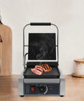 Heavy Duty Electric Panini Press Grill With 1800W Dual Heating Plates For Perfectly Grilled Steaks Hamburgers And Crispy Toasted Sandwiches featuring a grilled steak on the cooking surface.