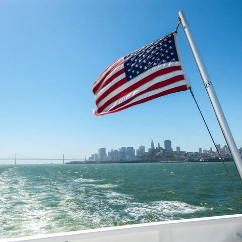 American Flag 12 By 18 Inches Embroidered 50 Stars Nylon Outdoor Banner For Marine Boat Yacht And UTV With Two Brass Grommets Built Tough Heavy Duty US Flag Designed For Outdoor Use flying on a boat.