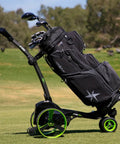 Top Tier Electric Golf Push Cart Bundle With All Terrain Folding Caddy showcasing black golf bag on cart with green wheels.