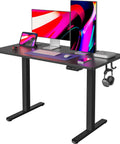Slick Smooth Electric Sit Stand Desk 48 By 24 Inch Heavy Duty Adjustable Height Workstation With Three Preset Buttons And Built In Side Hooks For A Killer Home Office Setup Matte Black with dual monitors and accessories.