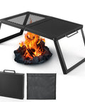 Folding Campfire Grill With Heavy Duty Steel Mesh Grate And Folding Legs Portable Over Fire Pit Rack For Outdoor Cooking Bonfires Camping And Picnics Includes Storage Bag next to a campfire, shown with carrying case and storage bag.