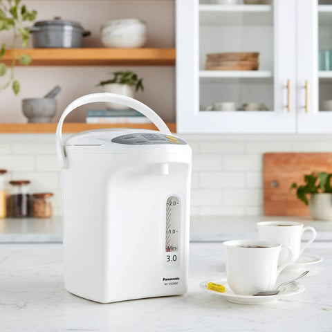 Your Go To 3L Hot Water Dispenser With Slow Drip Mode For Coffee And Tea on kitchen countertop near cups and saucers