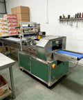 Compact Horizontal Flow Wrapper Shrink Wrap Machine 50 To 80 Pieces Per Minute with stainless steel design for efficient packaging.