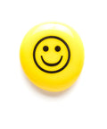 Geocache Swag Glass Stones Set Of Six With Fun Images In A Deluxe Gift Box showing a yellow stone with a smiley face