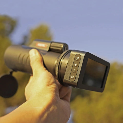 Person holding Pro Grade Spotting Scope Camera for Hunting and Camping with Adjustable Wireless Live HD Video and Dual Light.