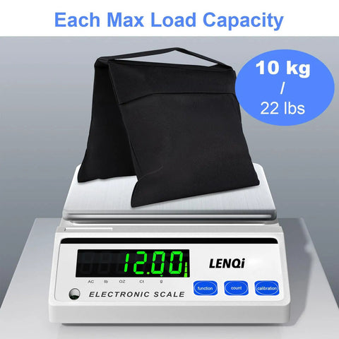 Two Pack Heavy Duty Sand Bags for Tripods, Umbrella Bases, and Photo Gear on electronic scale showing 12.00 kg