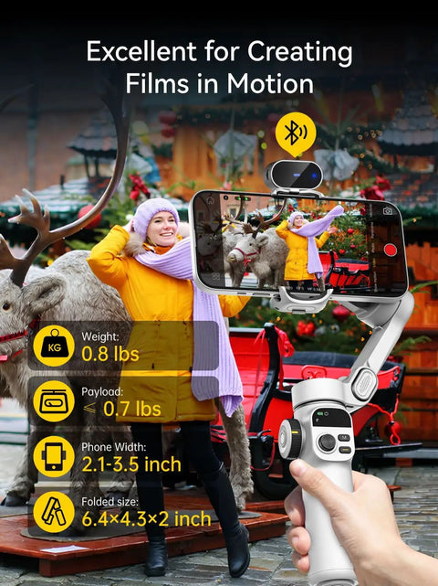3 Axis Phone Gimbal With AI Tracking Sensor holding smartphone, capturing person in orange coat with reindeer in background