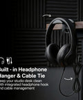 Black headphones on built-in desk hanger with cable tie, demonstrating desk setup for 2 Pack Desk Clamp Studio Monitor Stands.