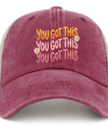 Front view of Low Profile Unstructured Vintage Tennis Trucker Hat For Men In Deep Rose with motivational text and daisies