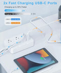Heavy Duty Surge Protector Power Strip With Six Separated AC Outlets And Dual USB C Plus Dual USB A Ports, tabletop charging with tablet.