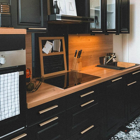 Modern kitchen with black cabinets featuring Six Pack Of 5 Inch Champagne Bronze Knurled Cabinet Pulls For Drawers And Dressers