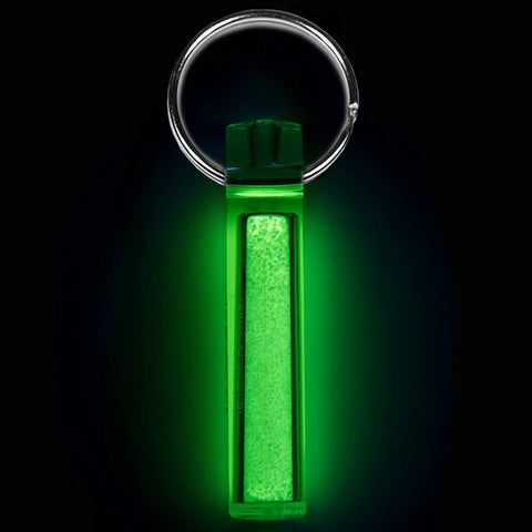 Ni Glo 2-Inch UV Rechargeable Glow Keychain For Camping Scuba Diving Night Fishing Hiking Emergency Kits And Everyday Carry A Multi-Purpose Glow In The Dark Accessory Attaches To Keys Backpacks Zippers Green 2 Pack. Glowing in the dark with a keyring.