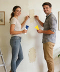 Couple using All In One Drywall Patch Kit With Scraper For Cracks And Holes Quick Fix For Home Walls And Apartments From Farmhouse To Basement
