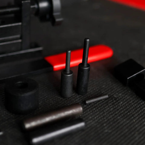Close-up of Mini Rod Bender Tool For Metalwork Universal Bending Machine parts on black surface