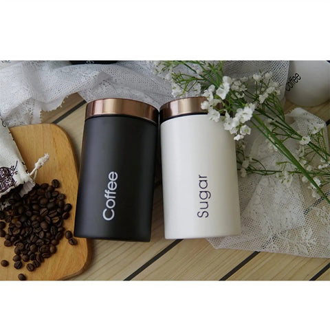 Solid Hella Airtight Metal Coffee Canister Set Keeps Your Beans Fresh And Tastes Dope With Wide Mouth Design For Snagging Tea Sugar And Daily Pantry Essentials, featuring black and white jars.