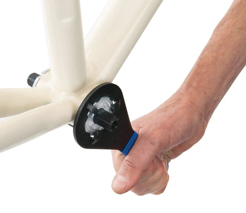 Bottom Bracket Wrench For Sealed Cartridges 44Mm Major Diameter And 38Mm Minor Diameter, 6-Notch SC-S And AC-H in use on bike frame.