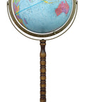 Treasury 12-inch globe on a turned wood stand with brass meridian ring; world map on blue oceans (front view).