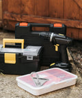 Top Notch Silver Aluminum Triangle Sliding Hooks For T Slot Tracks next to a drill and toolboxes on a work surface.