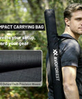 Man carrying Heavy Duty Adjustable Tarp Poles, 9.2ft Aviation Aluminum Telescoping Tent Poles bag, rugged outdoor setting.