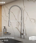 Moen Swyre Spring Pulldown Kitchen Faucet, 87538 with high arc spout and pullout wand, chrome finish on modern kitchen counter.