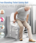 Elderly man using Foldable Toilet Safety Rail With Adjustable Height And Width Sturdy Carbon Steel Frame Built In Paper Holder
