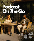 Two people using On The Go Podcast Studio Bundle With Dual CastMic Dynamic Mics outdoors at a wooden table.