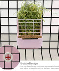 Super Cool Pink Two In One Rabbit Hay Feeder With Automatic Guinea Pig Food Bowl And Quick Release Grass Rack showing grass and food in tray.