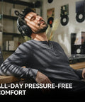 Man relaxing in studio wearing Studio Max 2 Wireless DJ Headphones With 9ms Ultra Low Latency Hi Res Audio LDAC 120 Hour Playtime.
