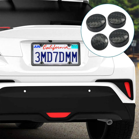 Dope Black Carbon Fiber License Plate Screw Caps And Fasteners featuring chrome caps on a white vehicle's rear license plate.
