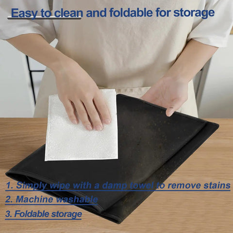 Person wiping a Black Single Serve Coffee Maker Cover For K-Supreme And K-Compact Pods with cloth on table