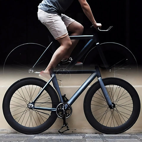 Cyclist on road bike with 700C Fixed Gear Wheelset with 70mm Aluminum Track Rims Front 100mm Rear 120mm Hubs V Brake Ready.