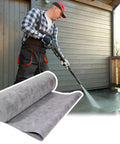 Man using a pressure washer on a patio while showcasing Easy As Pie Waterproof Shower Membrane Roll with Gloves for Bathroom Tile Floor.
