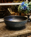 USZWBY Vessel Sinks Bathroom Vessel Sink Round Ceramic Washbasin on marble countertop with faucet.