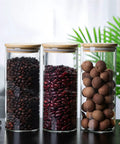 Heavy Glass Coffee Canister 2200Ml Wide Mouth Airtight Food Storage Jar For Tea Sugar Beans And Nuts displayed with beans and nuts.